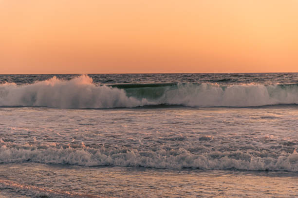 Southern California, USA - Pacific Ocean waves breaking onto a beach in Southern California