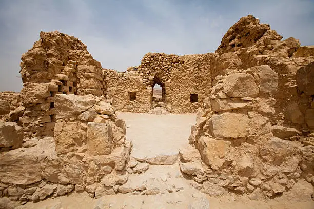 "Archaeology site in desert. Columbarium in Masada National park in Judean desert, Israel"