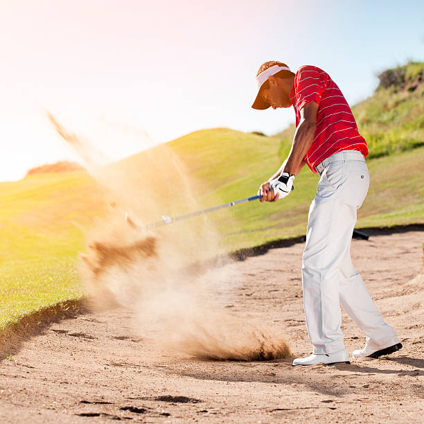 istock Golfer chipping the ball from sand trap 175489624