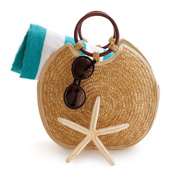 Beach bag Stylish beach bag with towel, sunglasses and starfish. beach bag stock pictures, royalty-free photos & images