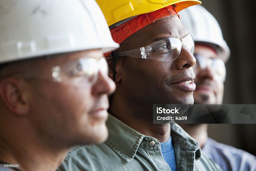 Primo piano di costruzione lavoratori - Foto stock royalty-free di Occupazione industriale