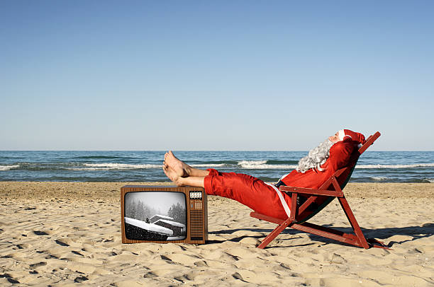 Santa Claus On Vacation, Sunbathing On The Beach