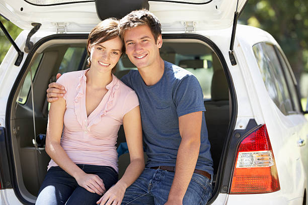 istock Couple Sitting In Trunk Of Car 175490539