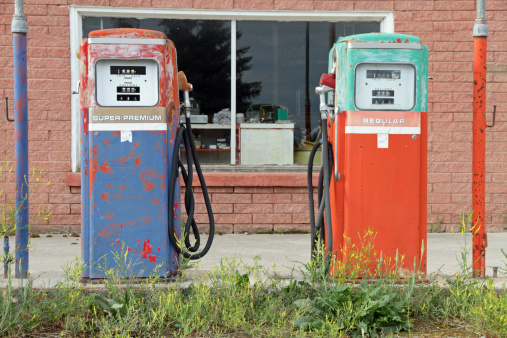 Old fashioned gas pumps at an abandoned station.