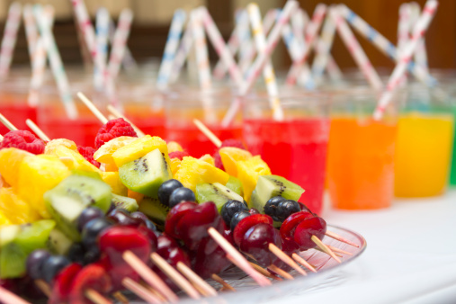 Fruit skewers on a serving platter at a birthday party. Very narrow depth of field.See related:
