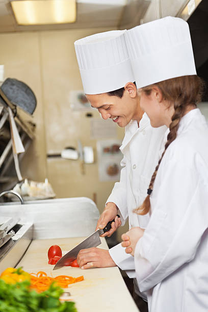 istock Chef training/teaching assistant to prepare food in commercial restaurant kitchen 175491223