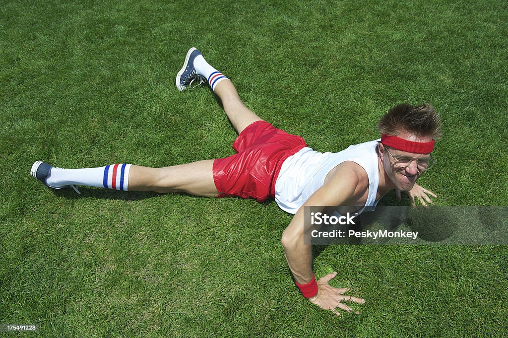 Nerd Athlete Struggles Doing Pushup in Green Grass Nerd athlete struggles to do a single pushup in green grass Push-ups Stock Photo