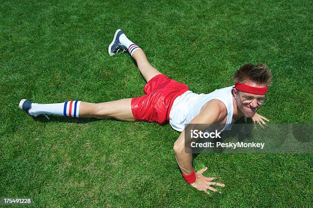 Nerd Athlete Struggles Doing Pushup In Green Grass Stock Photo - Download Image Now - Push-ups, Exhaustion, Humor