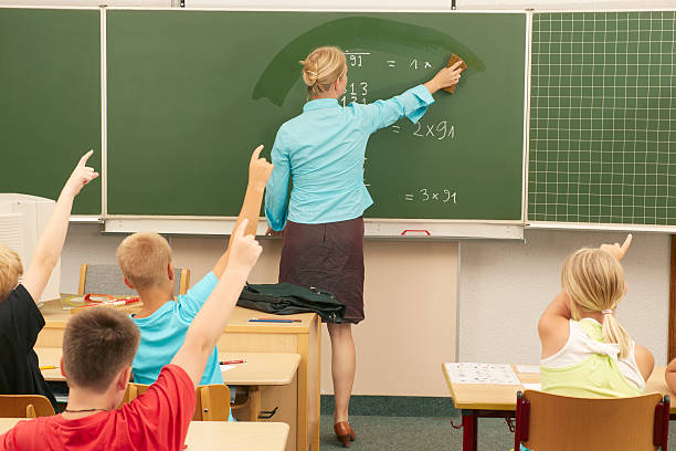 istock Teacher wiping the blackboard 175491593
