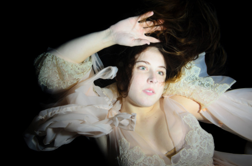 An haunting underwater shot of a beautiful woman.