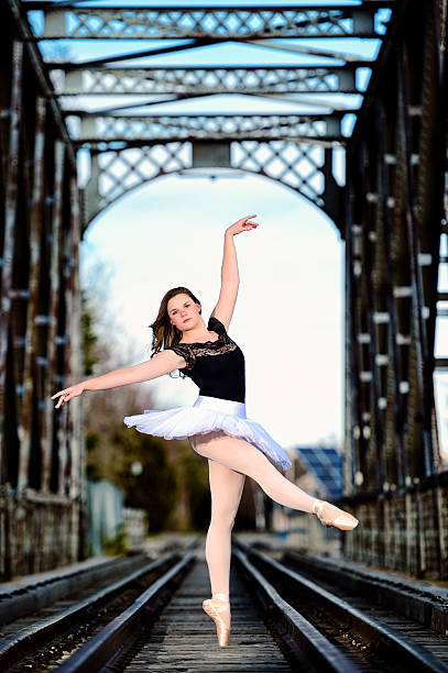 istock Ballerina On Toe - Railroad Tracks Under Trestle Bridge 175491933