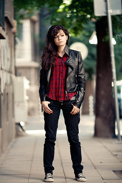Outdoor portrait of beautiful girl with leather jacket