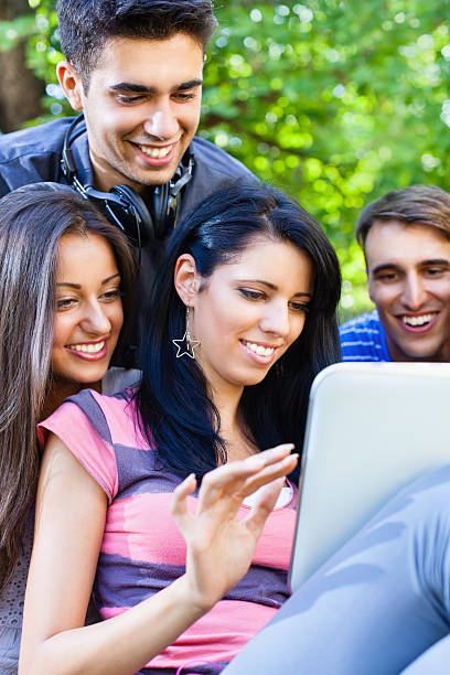 istock Group of young friends using digital tablet outdoors 175492239