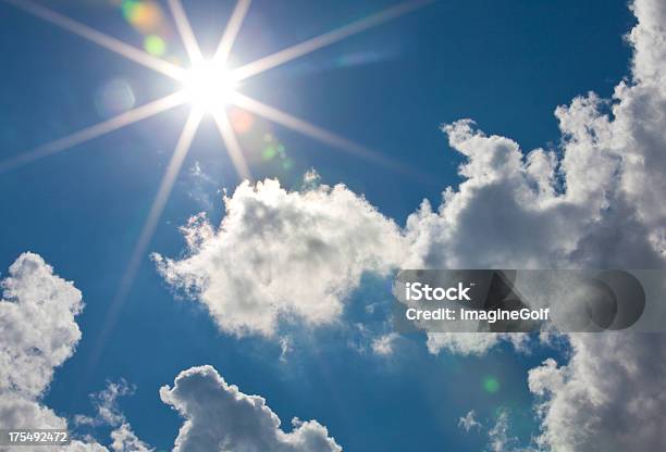 Cumulus Clouds With Sun Flare Stock Photo - Download Image Now - Abstract, Back Lit, Backgrounds