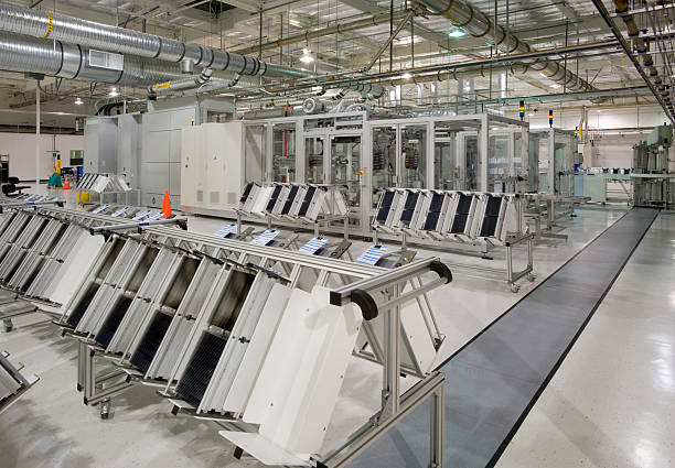 Solar Panel Manufacturing Plant Interior view of solar panel manufacturing facility. solar panel manufacturing stock pictures, royalty-free photos & images