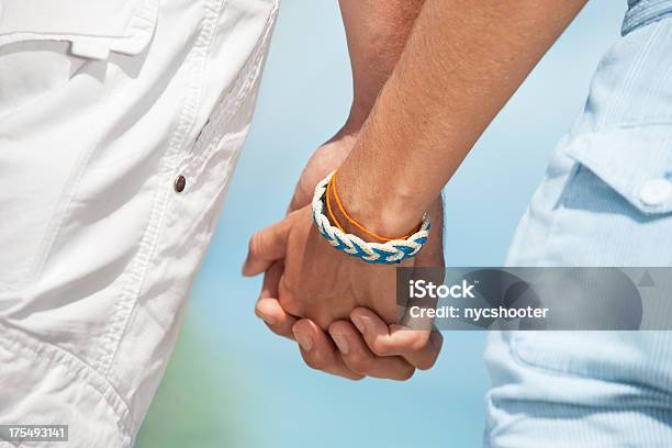 Couple Holding Hands Stock Photo - Download Image Now - 20-29 Years, Adult, Affectionate