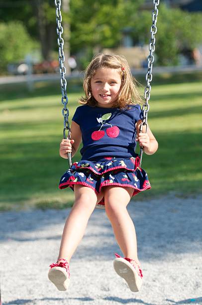 istock Young Girl Playing on Swing 175493197