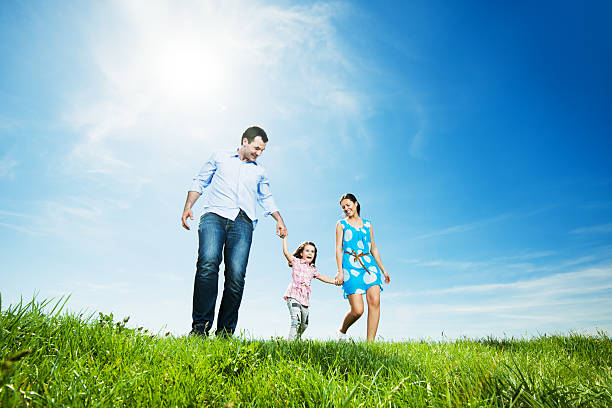 Happy family in park taking a walk
