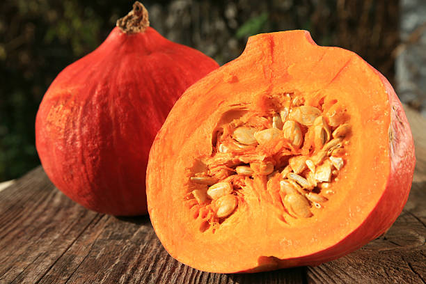 Close-up of bright orange halved garden squash stock photo