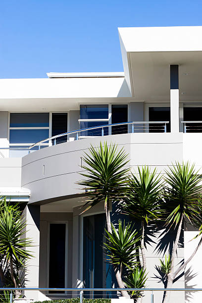 istock Modern white house with palm trees, bue sky, copy space 175494280