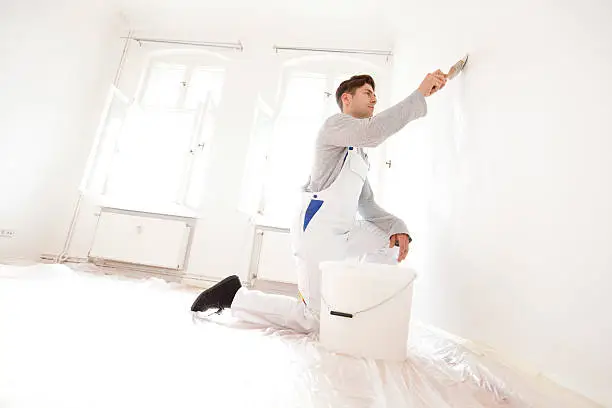 Young man refurbishing a home