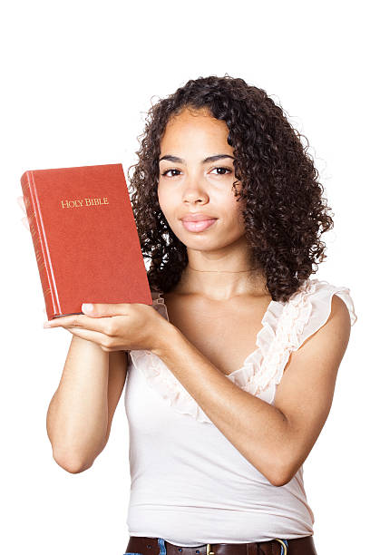 istock Girl holding bible on white background 175494872