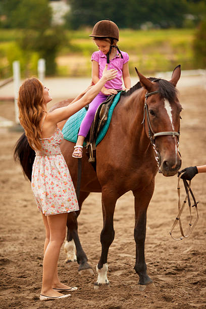 istock Child Riding Horse Outdoors. 175494938