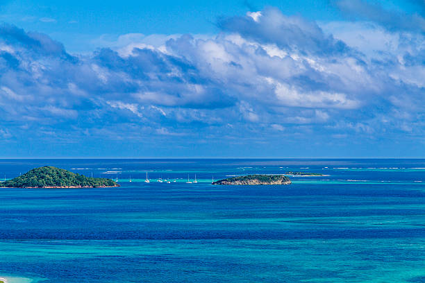 Tobago Cays The Tobago Cays surrounded by the beautiful blue and turquoise shades of the Caribbean Sea. Photo taken from Mayreau Island. St. Vincent and the Grenadines. tobago cays stock pictures, royalty-free photos & images