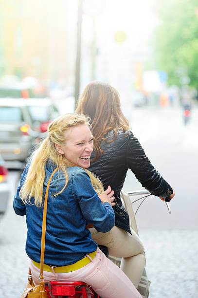 istock Young women on moving bike 175496291
