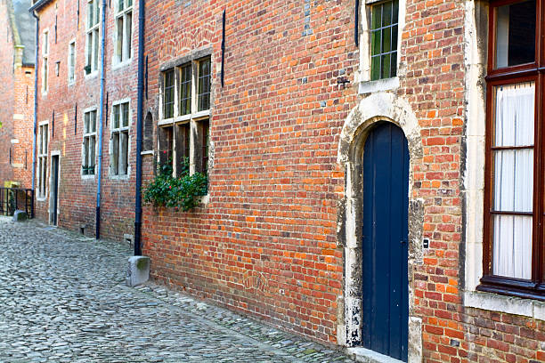 Medieval beguine building in Leuven, Belgium. Part of great beguine's settlement Groot Begijnhof. Nowadays free to visit and used as living houses for students and teachers of university. In 1795 beguine's settlement was closed.