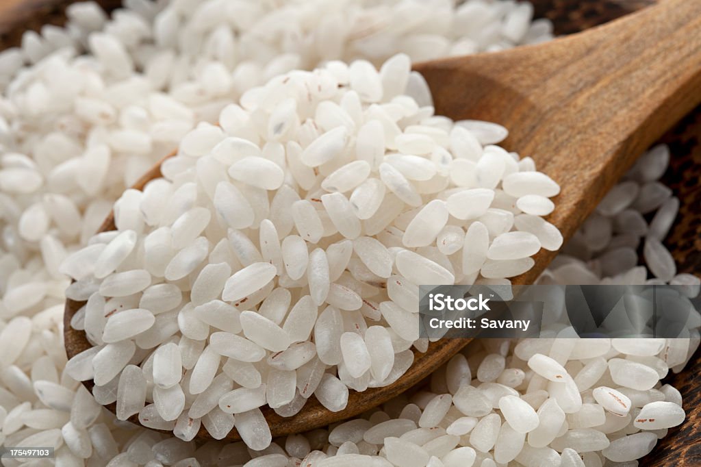 Rice Rice in wooden spoon Cereal Plant Stock Photo