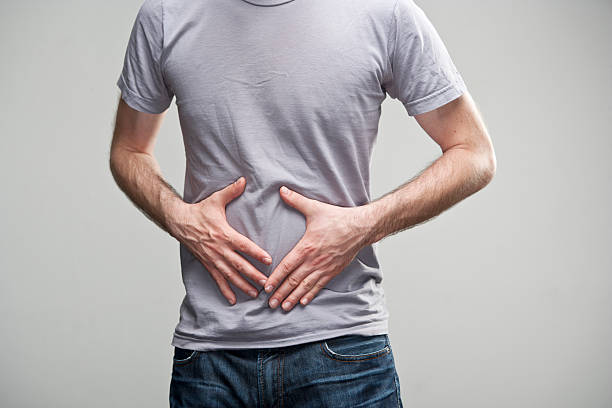 Stomach ache A man, having a sudden stomach ache. XXL size image. iStockalypse Berlin, 2012. human intestine photos stock pictures, royalty-free photos & images
