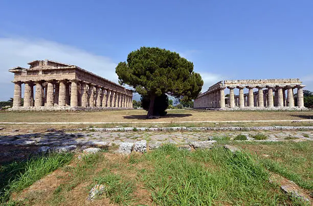 "The Ancient temples of Neptune and Poseidon at PaestumItalyPaestum is the classical Roman name of a major Graeco-Roman city in the Campania region of Italy. It is located in the north of Cilento, near the coast about 85 km SE of Naples in the province of Salerno."