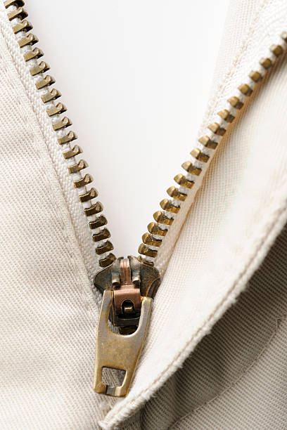 istock Isolated shot of opened old pants zipper on white background 175497591