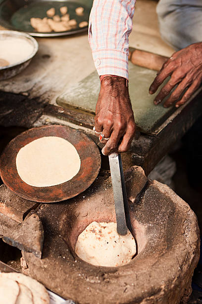 istock Indian street vendor preparing food - chapatti, flat bread 175498070