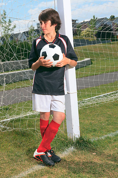 istock Kid Soccer - Holding Ball 175498262