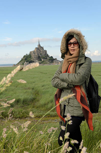 Mont-Saint-Michel is a tidal island and mainland commune in Normandy, France. The island lies approximately one kilometre off France's north-western coast. This picture was taken during spring, when the weather is so unpredictable. I also managed to capture some of the sheep roaming around