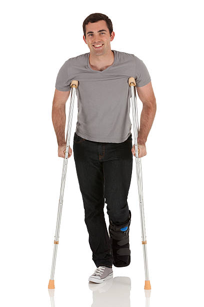 istock Injured man walking with the help of crutches 175498333