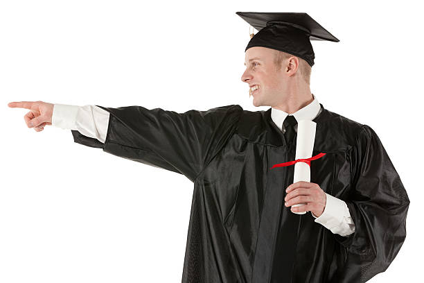 istock Male graduate holding a diploma and pointing 175498922