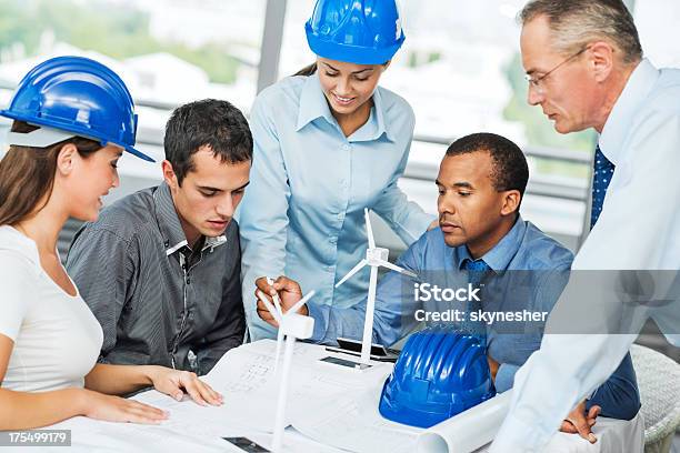 Group Of Architects Working On A Wind Turbine Project Stock Photo - Download Image Now