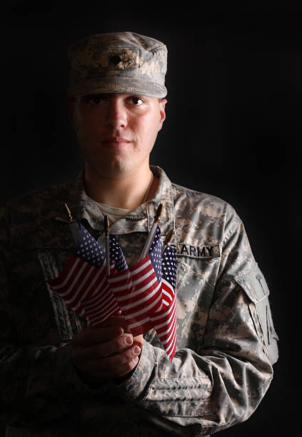 istock U.S. Soldier with American flags 175499580