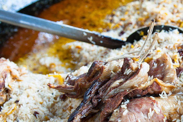 istock closeup of plov, cooked rice and meat 175499813