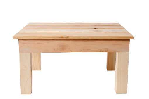 Small handmade wooden table isolated on white background with clipping path.