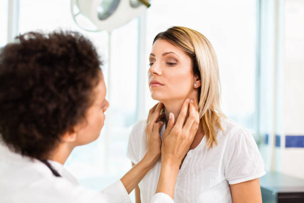 istock Female doctor checking thyroid gland 175500003