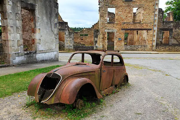 "Oradour-sur-Glane is a commune in the Haute-Vienne department in the Limousin region in west-central France. The original village was destroyed on 10 June 1944, when 642 of its inhabitants, including women and children, were massacred by a German Waffen-SS company. A new village was built after the war on a nearby site but on the orders of the then French president, Charles De Gaulle, the original has been maintained as a permanent memorial."