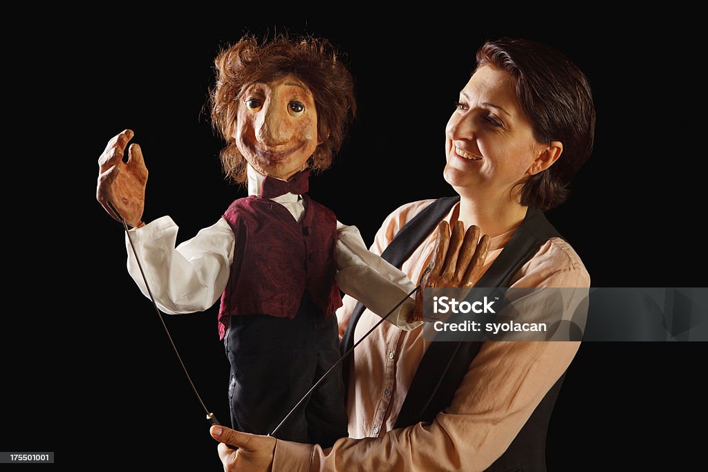 Puppeteer Puppeteer with her Rod Puppet,  Puppet Show Stock Photo
