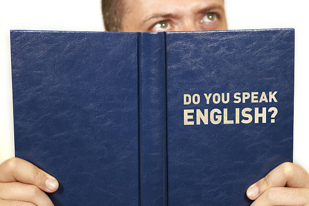 Do you speak english Man read a book english culture stock pictures, royalty-free photos & images