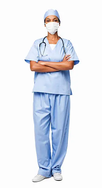 Full length portrait of an African American female healthcare professional in scrubs. Vertical shot. Isolated on white.