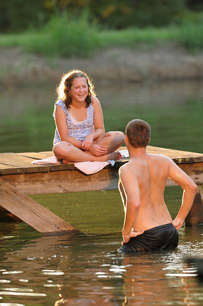 istock Children being silly in small lake 175501592