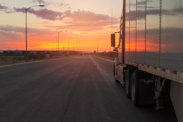 istock trucks and traffic at sunset. highway road 1755016449